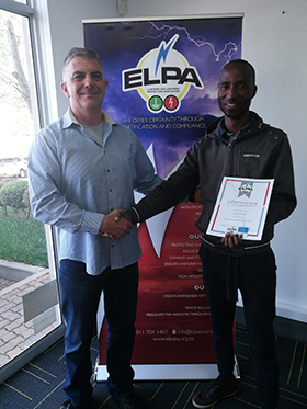 First ELPA exam Trevor Manas with successful candidate