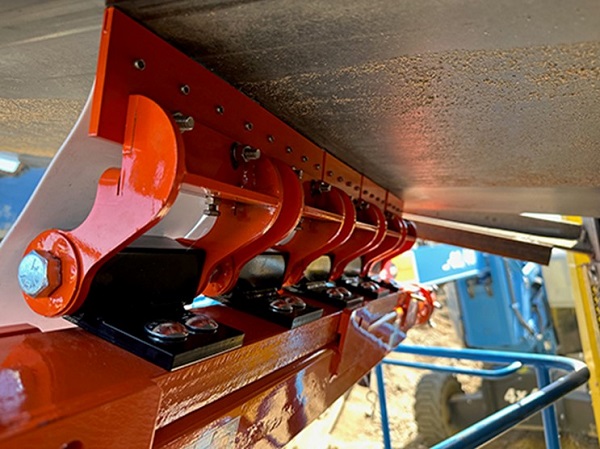 New secondary conveyor belt cleaner designed for safety and easy maintenance